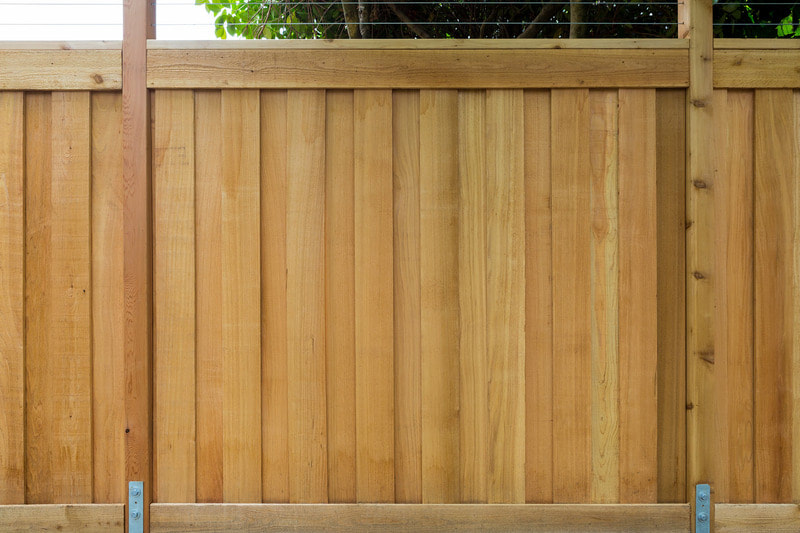 Beautifully designed wooden fence, ready to be stained.