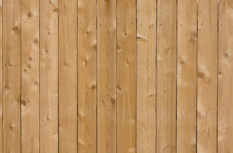 This is a close up of a wooden fence that we recently installed for a homeowner in Kenosha.