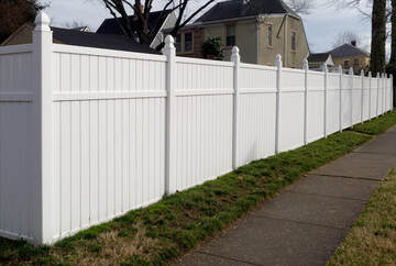 This is a vinyl fence. They are becoming more and more common as people love the look and feel they provide. This is a white vinyl fence to be exact.